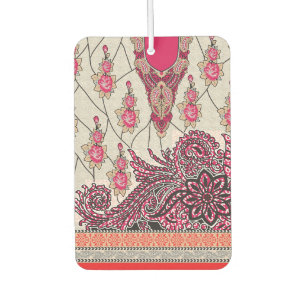 A decorative paisley design with vivid red and pin car air freshener