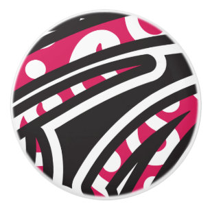 A decorative paisley design with vivid red and pin ceramic knob