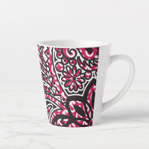 A decorative paisley design with vivid red and pin latte mug