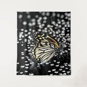 A delicate butterfly with drops of dew tapestry