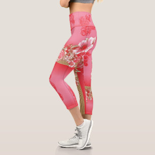 a design of a pink and gold background with a red capri leggings