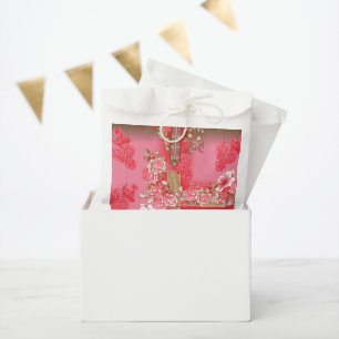 a design of a pink and gold background with a red favour bag