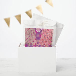 a design of a purple background with dots favour bag