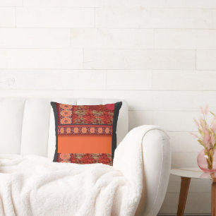 a design of a red and gold pattern cushion