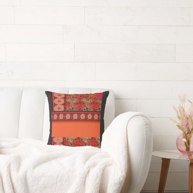 a design of a red and gold pattern cushion (Couch)