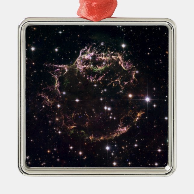 A detailed view at the tattered remains metal tree decoration (Front)