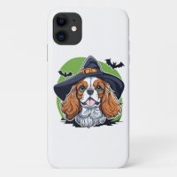 A dog wearing a witches hat with bats