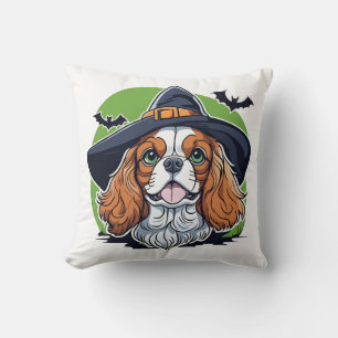 A dog wearing a witches hat with bats cushion