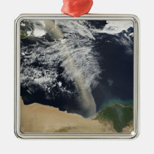 A dust plume metal ornament