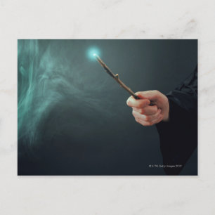 A fantasy wizard making magic with wand. postcard