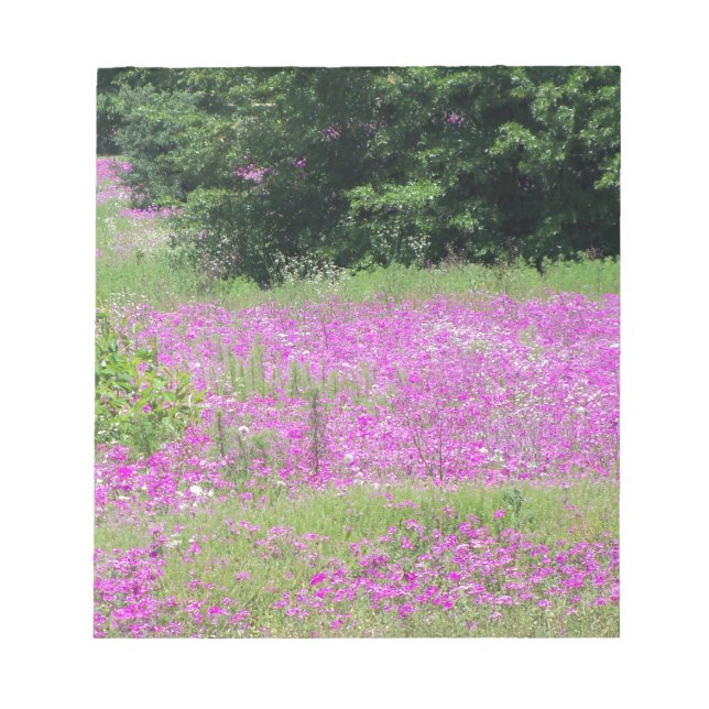 A field of pink spring wildflowers notepad (Front)