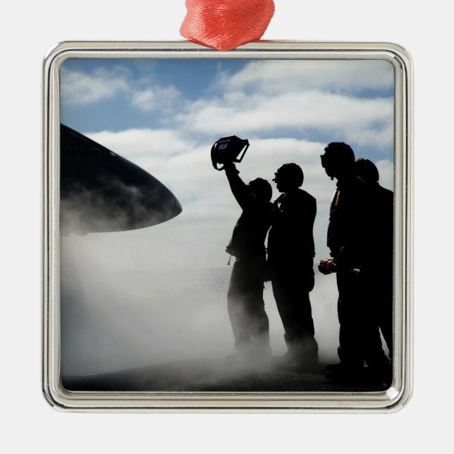 A flight deck crew member metal ornament (Front)