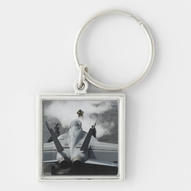 A flight deck director signals an F/A-18F Key Ring (Front)