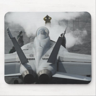 A flight deck director signals an F/A-18F Mouse Pad