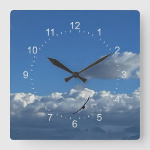 A flight under the clouds square wall clock