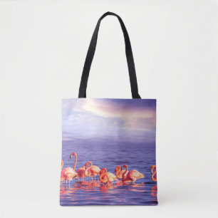 A flock of beautiful pink flamingos against a purp tote bag