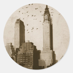 A flock of birds flying classic round sticker