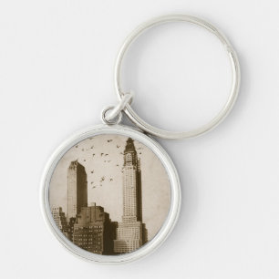 A flock of birds flying key ring