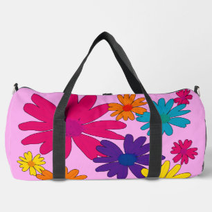 A floral bed of daisy flowers duffle bag