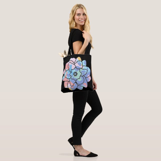 A flower made of paint stains tote bag (On Model)