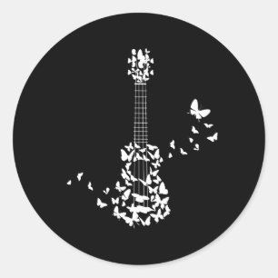A Four String Ukulele Instrument With Beautiful Classic Round Sticker
