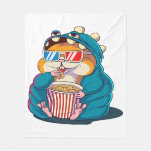 A funny hamster wearing glasses eats popcorn fleece blanket