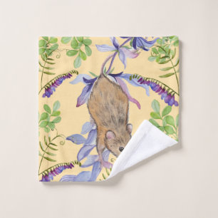 A funny mouse in a thicket of flowers. wash cloth