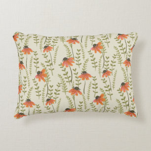 A garden of green ferns brightened by orange flowe decorative cushion