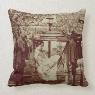 A Geisha being carried in a litter (sepia photo) Cushion