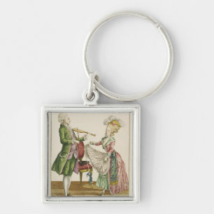 A gentleman playing the violin while a lady dances key ring