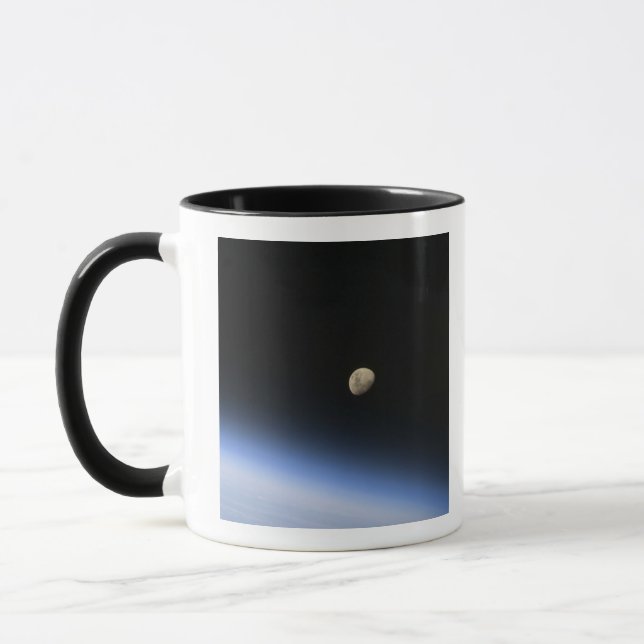 A gibbous moon visible above Earth's atmosphere 2 Mug (Left)