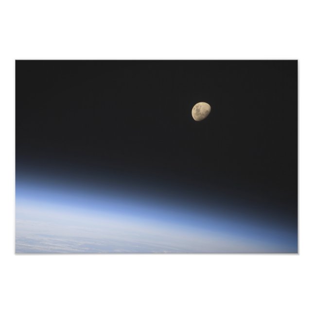 A gibbous moon visible above Earth's atmosphere 2 Photo Print (Front)