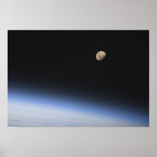 A gibbous moon visible above Earth's atmosphere 2 Poster
