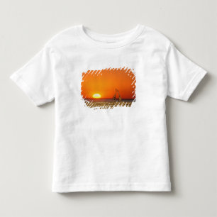 A Giraffe couple walks into the sunset, in Toddler T-Shirt