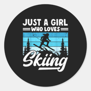 A girl who loves skiing fun winter sports ski classic round sticker