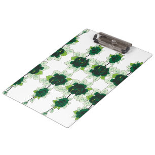 A golden retriever puppy sits on a grassy field, w clipboard