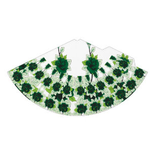 A golden retriever puppy sits on a grassy field, w party hat