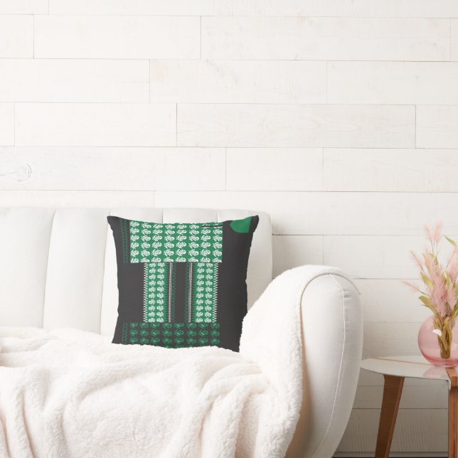 a green and black pattern with a tree in the middl cushion (Couch)