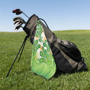 A green and gold artistic pattern depicting a tree golf towel