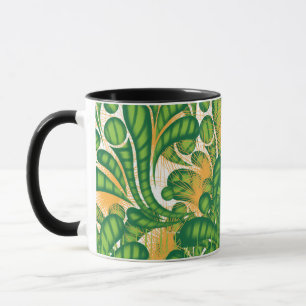 A green and gold artistic pattern depicting a tree mug