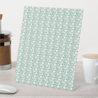 a green and white background with a pattern