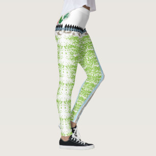 a green and white background with small dots leggings