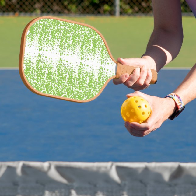a green and white background with small dots pickleball paddle (Insitu)