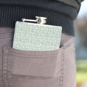 a green and white background with small leaves hip flask