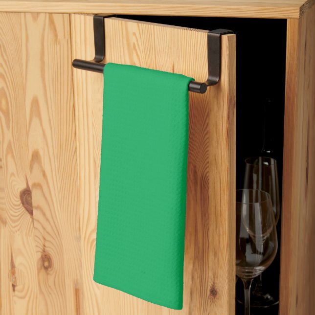 a green background with a tea towel (Thirds Fold)