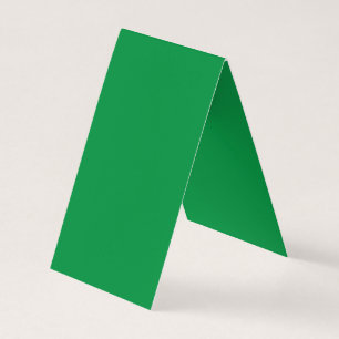 a green background with a white border business card