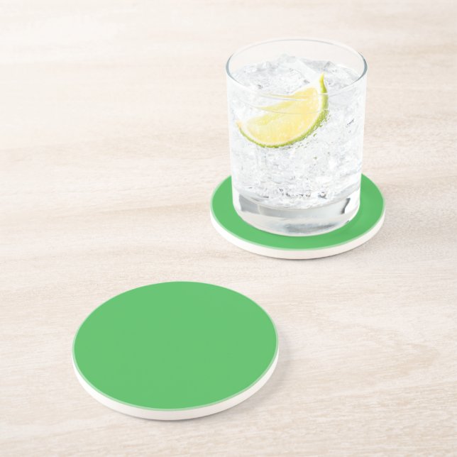 a green background with a white border coaster (Side)