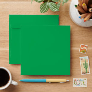 a green background with a white border envelope
