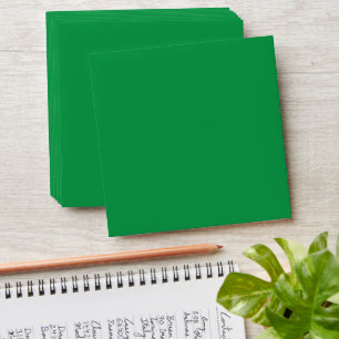 a green background with a white border envelope