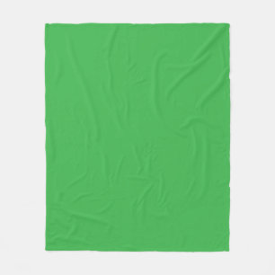 a green background with a white border fleece blanket